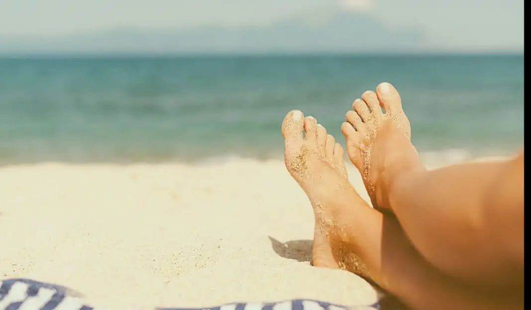 sandy feet at the beach