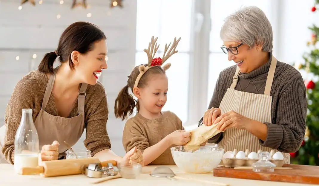 mom, child and grandmother baking in the kitchen